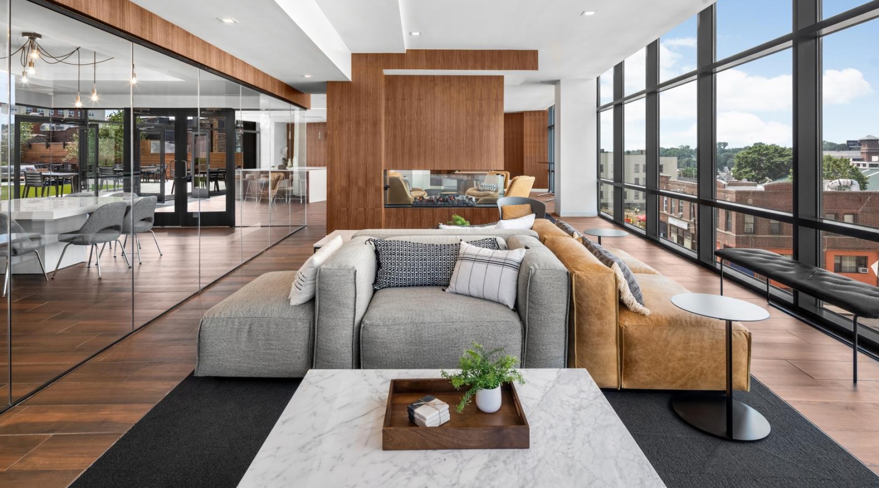 a modern looking living room with a large glass wall